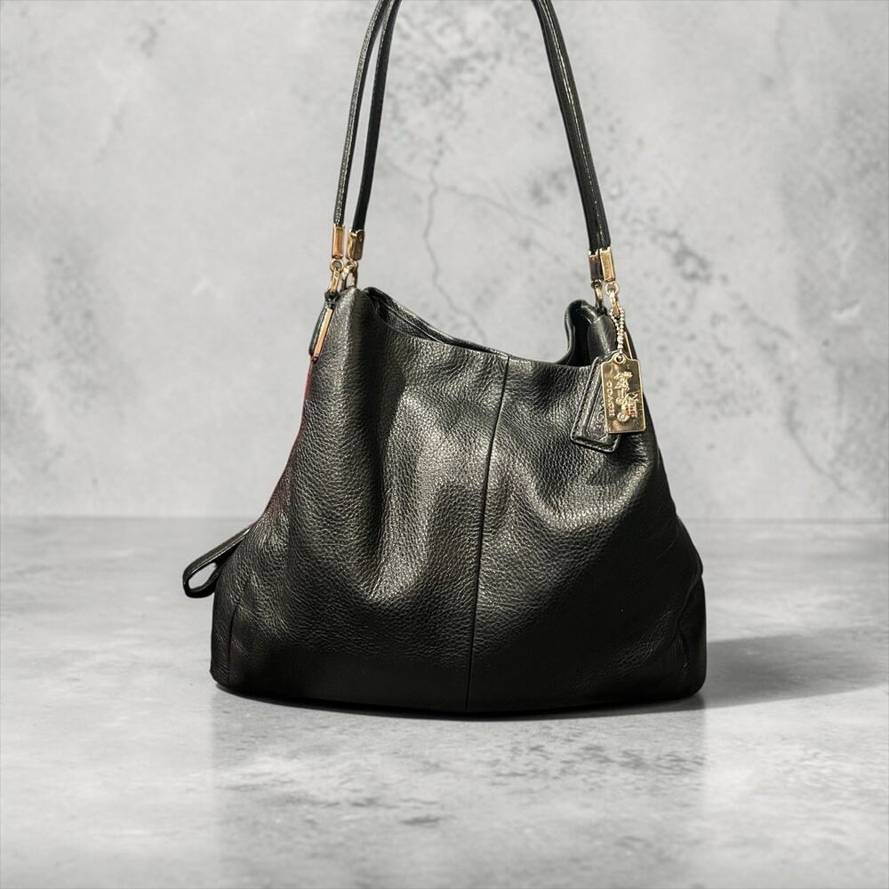 a Coach Madison Phoebe shoulder bag in black pebbled leather